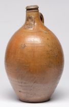 A German saltglazed brown stoneware Bartmann bottle, c1700, applied with bearded mask and