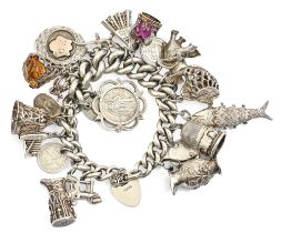 A silver charm bracelet, 159g Good condition. Several of the earlier charms with typical wear