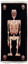 A Tibetan skeleton rug, 145cm x 67cm