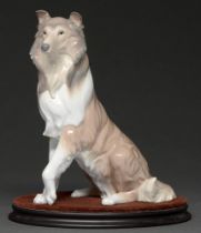 A Lladró model of a collie dog, 25.5cm h, blue printed marks and impressed numbers 6455/A-5J, wooden