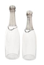 Two Victorian silver mounted glass champagne bottle novelty decanters, with star cut base and BRANDY