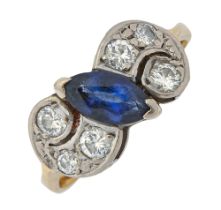 A sapphire and diamond ring, the navette shaped sapphire flanked by groups of old cut diamonds, in