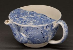 Medical antiques. An English blue printed earthenware spout cup, c1830, with a floral sheet print,