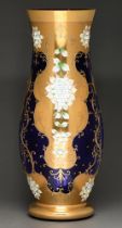 A Bohemian cobalt glass vase overlaid with gilt and enamel flowers, late 20th c, 59.5cm h