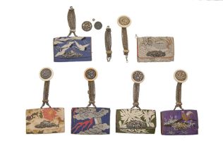 Six Japanese silk and leather tobacco pouches, early 20th c, with chased and silvered brass dragon