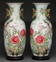 A pair of Chinese famille rose vases, 20th c, enamelled with peony and peafowl, the reverse with