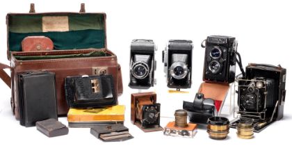 An Ica folding quarter plate camera, with Zeiss Tessar 13.5cm F4.5 lens, several plate holders and a