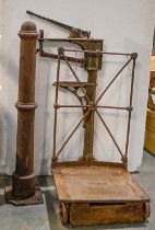 A Victorian cast iron stanchion, with domed top and square foot, 123cm h and a Victorian or