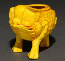 A yellow glazed art pottery miniature vessel in the form of a grotesque toad, in the manner of