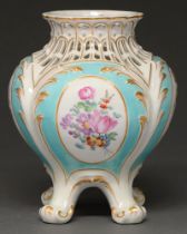 A Derby vase, c. 1765-70, painted with polychrome flowers within oval frames and reserved on a