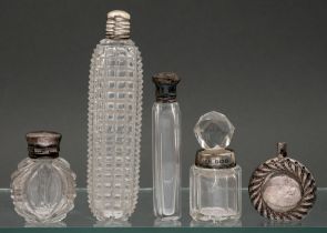 Four various silver mounted cut and faceted glass scent bottles, 19th and early 20th c and a