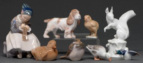 A Meissen glazed porcelain model of a squirrel on a tree stump and seven Royal Copenhagen and Bing