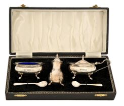 An Elizabeth II three-piece silver condiment set, blue glass liners, pepperette 85mm h, by W I