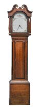 A Victorian thirty hour oak and crossbanded longcase clock, the breakarched and painted dial with