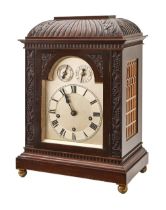 A mahogany bracket clock, early 20th c, silvered arched dial with Roman chapter, twin-winding holes,