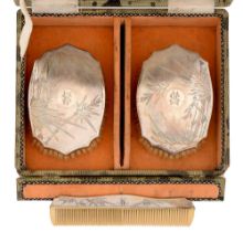 A pair of Chinese silver brushes and a comb, c1930, engraved with bamboo, cased Good condition