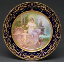 A Vienna style cabinet plate, early 20th c, painted with Putto and a maiden in cobalt and raised