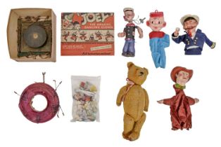 Vintage toys, including a clockwork Popeye figurine with trade label ©King Features Syndicate