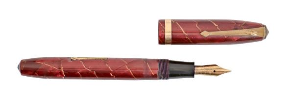 A Conway Stewart marbled pink lady's fountain pen, marked on gold nib 14ct GOLD Good condition;