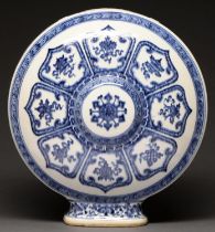 A Chinese blue and white moon flask, painted in the manner of ‘heaping and piling’ with lotus