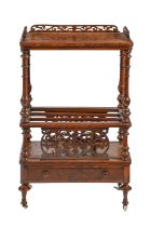 A Victorian walnut canterbury, on turned legs and pottery castors with fretwork decoration, 93cm