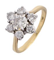 A diamond ring, with one larger and six smaller round brilliant cut diamonds, in gold marked 18ct,