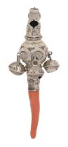 An English silver baby's rattle, c1840, with coral handle, 95mm l, 12dwts Slightly dented and worn