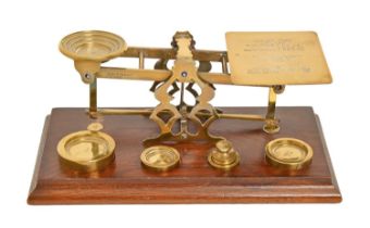 A late Victorian brass postal balance, by Sampson Mordan & Co, London, with weights, 27cm w Good