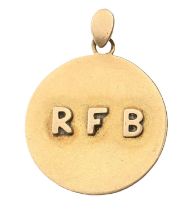 A gold pendant, applied with initials, 21mm diam, marked 18ct, 2.5g Slight wear