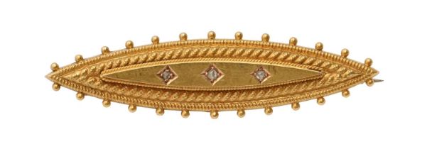 A Victorian 15ct gold shuttle shaped brooch, set with three chip-diamonds, 44mm l, Chester 1897, 2.