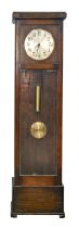 An oak 1930's longcase regulator clock, with silvered dial and chiming movement, weights and