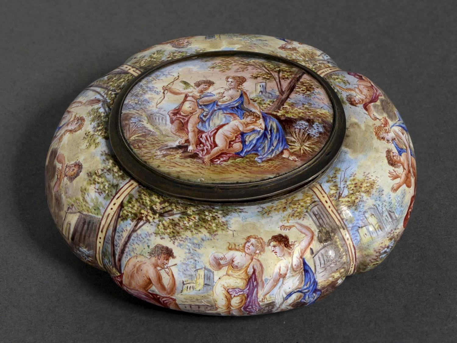 A Viennese silver gilt and painted enamel box and cover, c1900, of lobed cushion shape, painted with