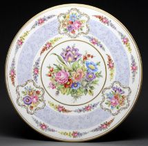 A German porcelain plaque, second half 20th c, decorated with flowers in lavender and gilt border,