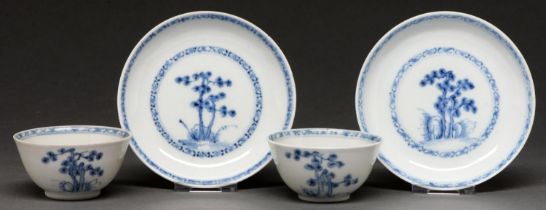 Nanking Cargo. Two blue and white tea bowls and saucers, c1750, painted with the 'Blue Pine'