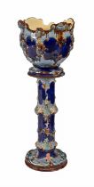 A majolica jardiniere and pedestal, c1900, decorated predominantly in cobalt, manganese and