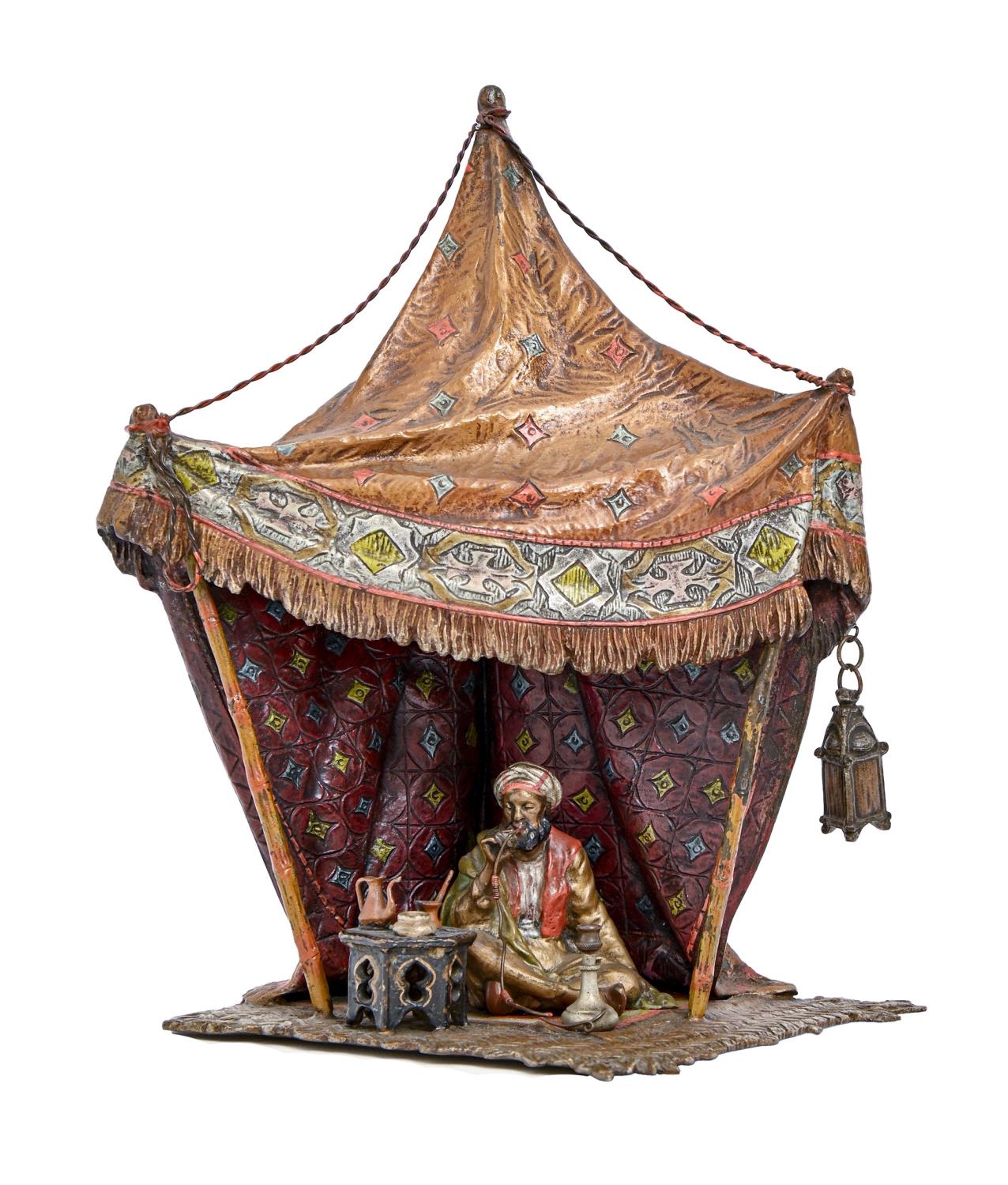 A cold painted Vienna bronze orientalist lamp of an Arab seated in a tent, Bergman Foundry, early