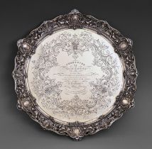 Irish interest. A fine Victorian silver testimonial salver, the field engraved with shells and leafy