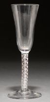 A wine glass, mid 18th c,  the bell bowl on multiple spiral air twist stem and conical foot, 16.