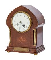 An Art Nouveau style brass mounted and inlaid mahogany mantel clock, c1920s, with enamel dial,