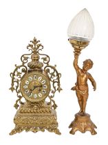 An ornate pierced brass mantel clock, in 18th c French style, the dial with enamel chapters, 43cm