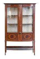 An inlaid mahogany bow fronted china cabinet, 177cm h; 107 x 46cm Good condition