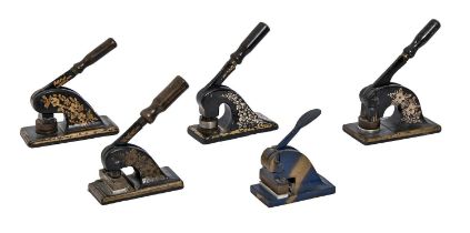 Four Victorian or Edwardian black and gilt iron paper embossers and another Condition evident from