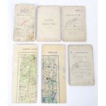 A collection of WWII era military folding maps.