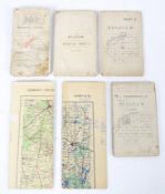 A collection of WWII era military folding maps.