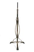 An Art Nouveau brushed steel standard lamp. The column decorated with three.
