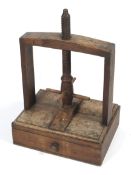 A 19th century oak book press. With turned screw thread and turned handles, with lower drawer,