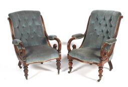 A pair of Victorian mahogany framed button back armchairs.