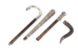Assorted silver and white metal tops for walking canes, 19th century and later.