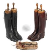 Two pairs of men's leather riding boots with trees, one pair in dust bags.