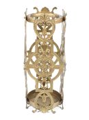 A decorative gilt stick stand of cylindrical form.